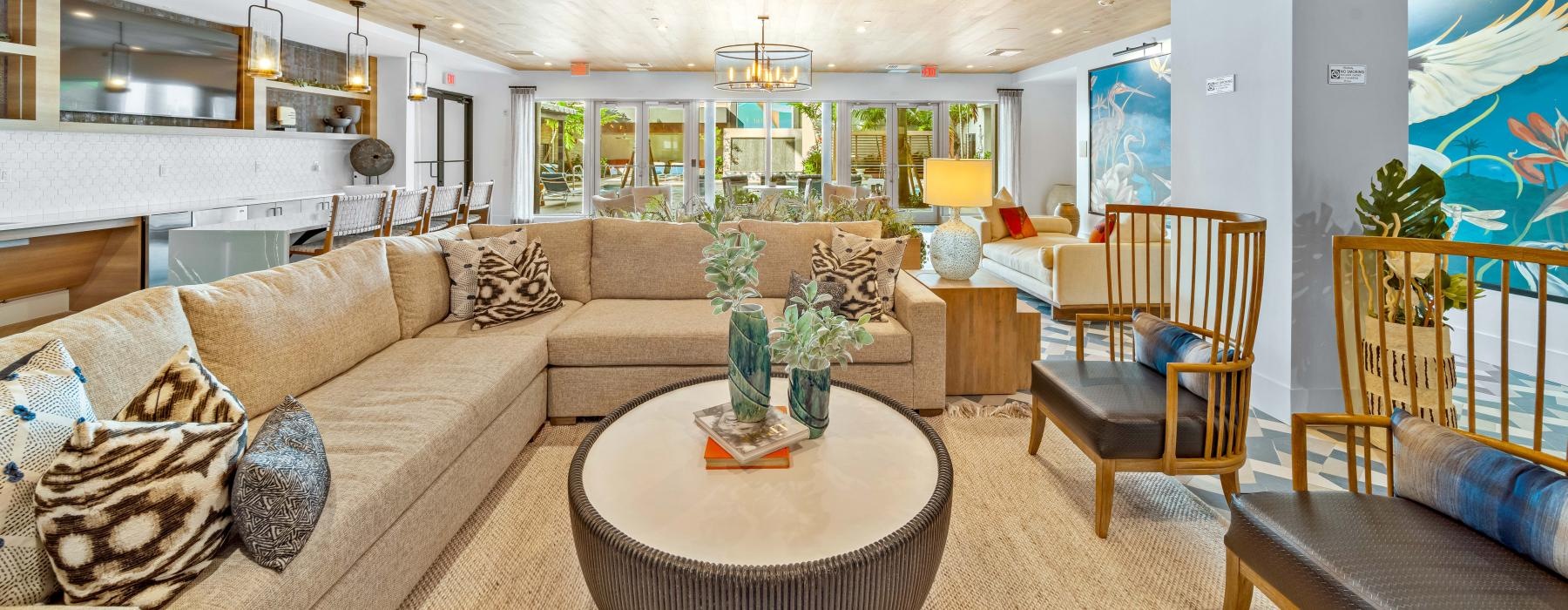 a living room with a chandelier and couches