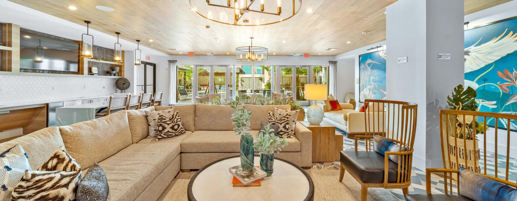 a living room with a chandelier and couches